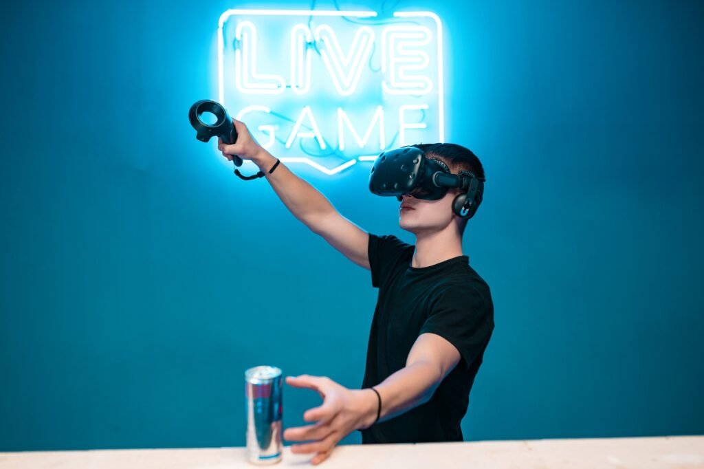 A young man drinks energy while playing